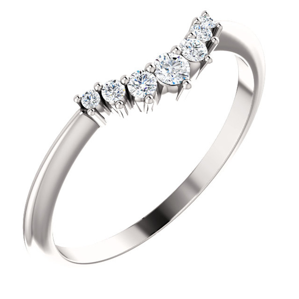 On your wedding day, speak your vows proudly as you slip this ring on her waiting finger. Fashioned in sleek 14K white gold, this band is set with a quartet of shimmering diamonds, all totaling 1/8 ct. Slightly contoured, this band was designed to fit snuggly beneath her solitaire. Polished to a brilliant shine, it's destined to become one of her most treasured pieces.