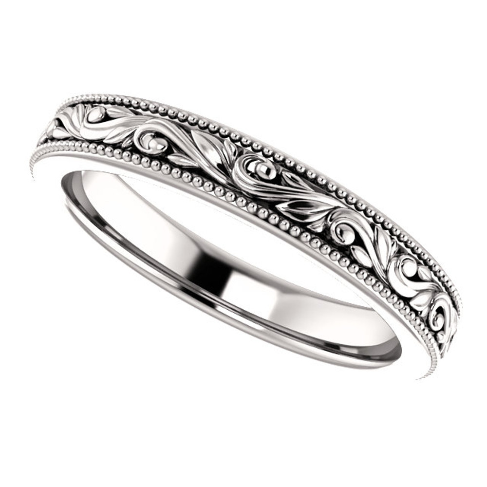 Exquisitely hand-engraved, this wedding ring features a beautiful design in 14k white gold.