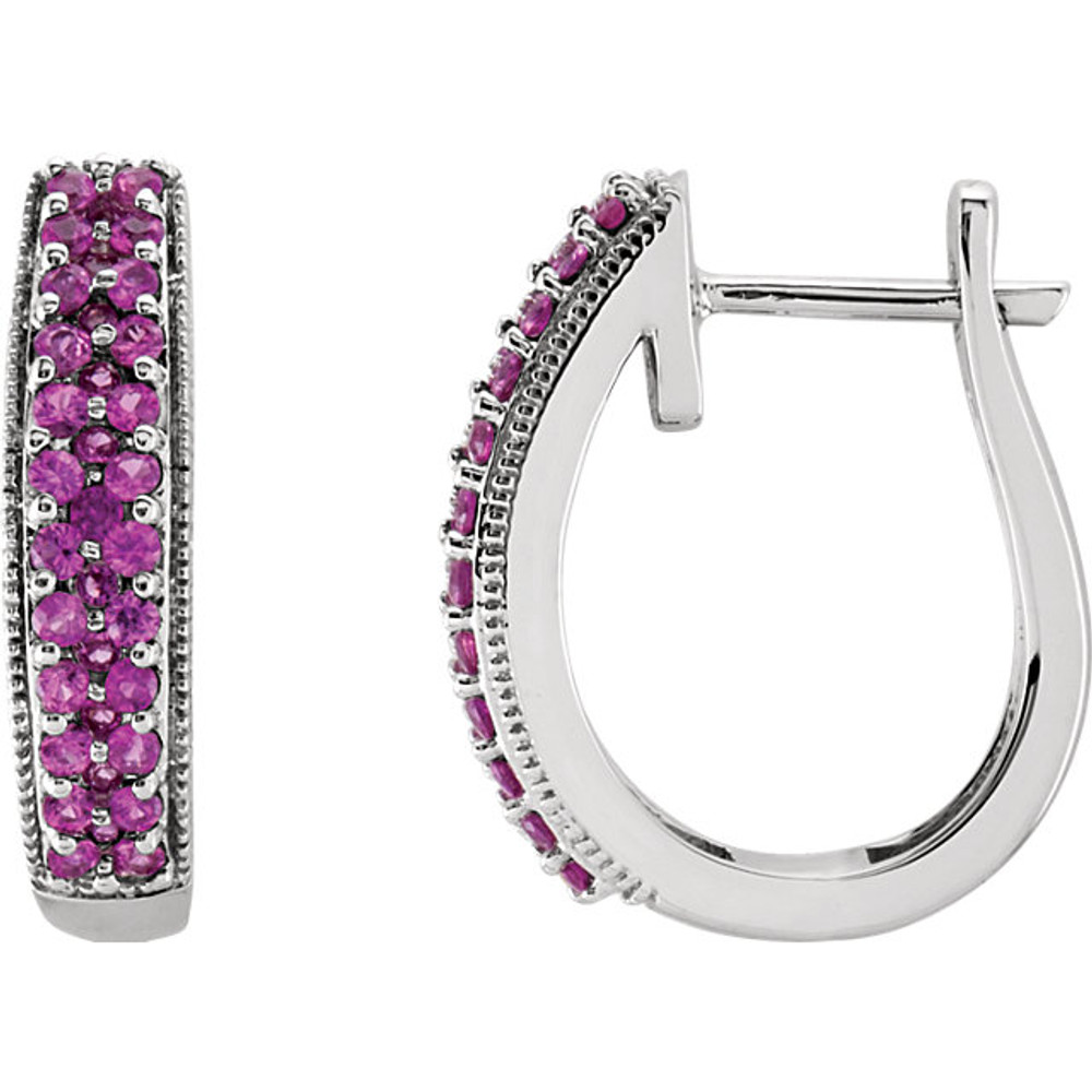Exquisite 14Kt white gold hoop earrings capturing the beauty of gorgeous pink sapphires. The length of the hoops is 18.5mm.
