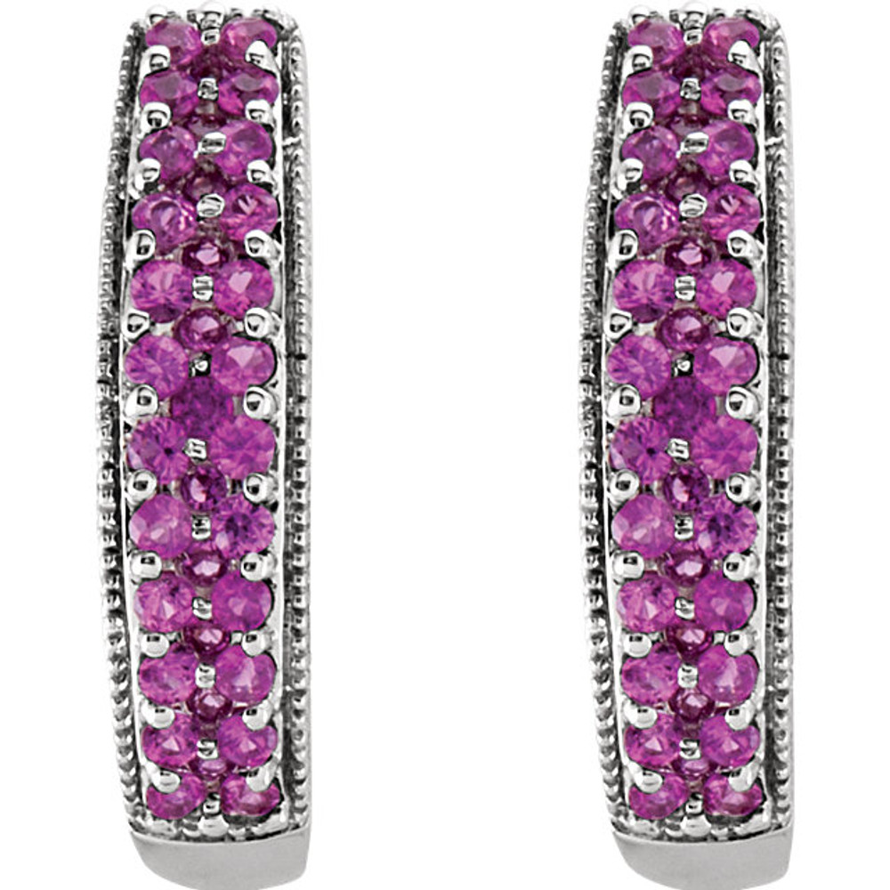 Exquisite 14Kt white gold hoop earrings capturing the beauty of gorgeous pink sapphires. The length of the hoops is 18.5mm.