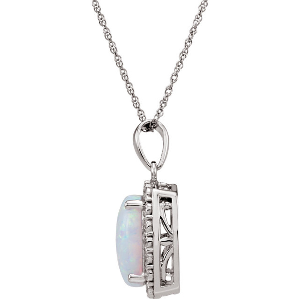 This stunning 14K white gold solitaire pendant necklace features a 10x8mm cushion Created Opal that is complemented by brilliant-cut round diamonds. This october birthstone jewelry would look perfect with any outfit.