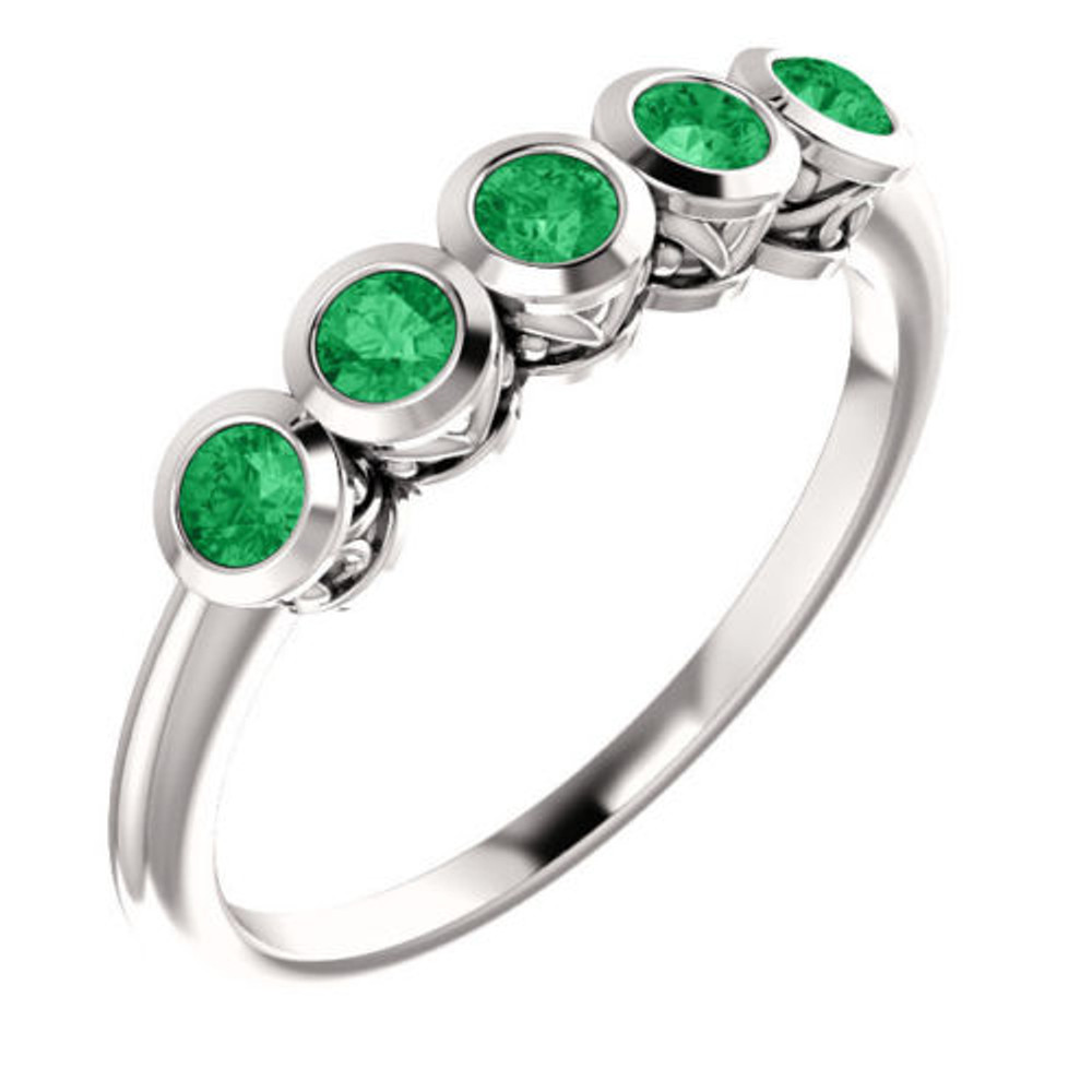 Crafted in 14k white gold, this ring features 5, round, emerald gemstones. 