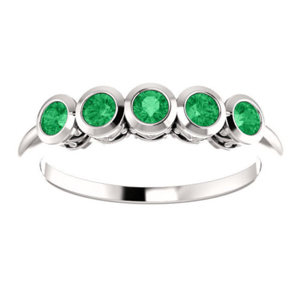 Crafted in 14k white gold, this ring features 5, round, emerald gemstones. 