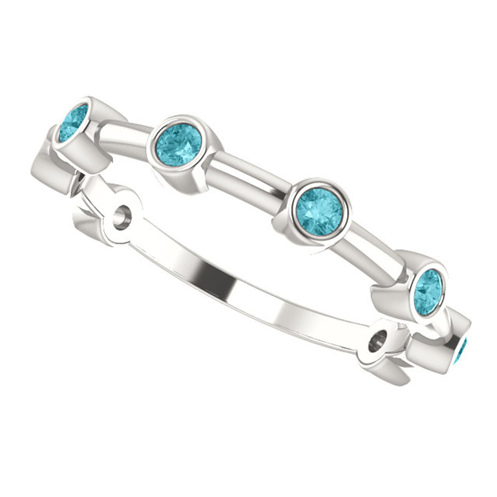 Crafted in platinum, this ring features 8, round, blue zircon gemstones. 
