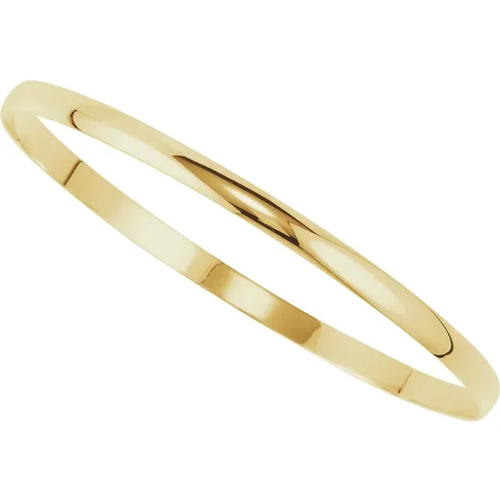 Crafted in brightly polished 14k yellow gold, this half round bangle bracelet is lightweight yet looks substantial. A statement piece on its own, stack with other bracelets for an on-trend look.