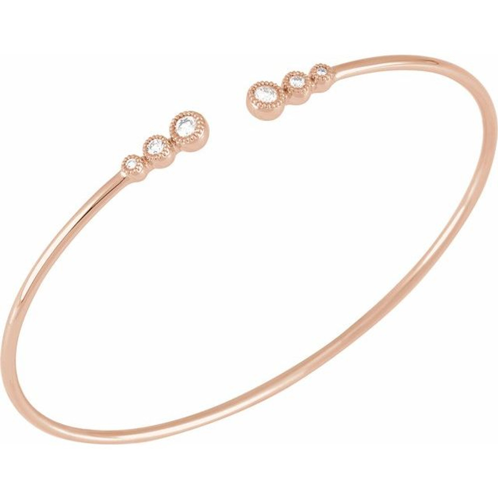 This graduated bangle bracelet showcases round diamonds set in 14k rose gold.