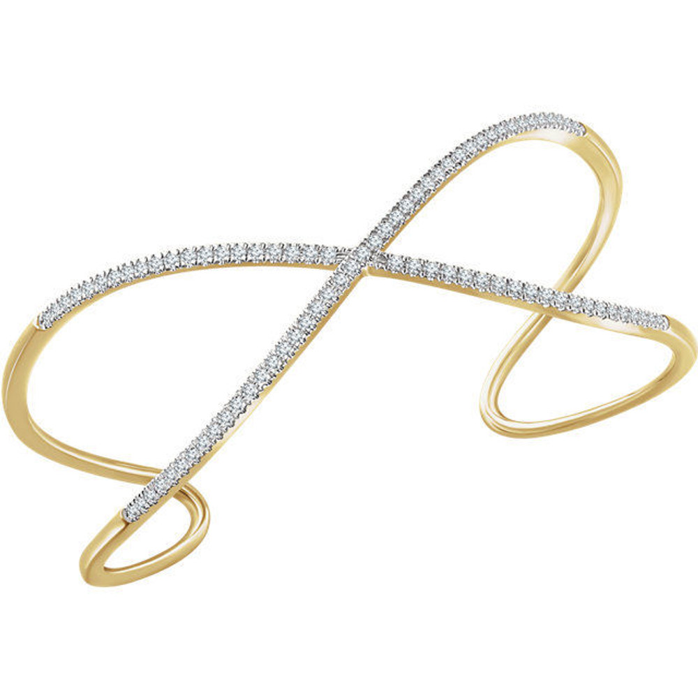 Diamond Cuff Bracelet in 14Kt yellow gold with 86 diamonds weighing 3/4 ct tw. Adds the perfect edge to a night out. 