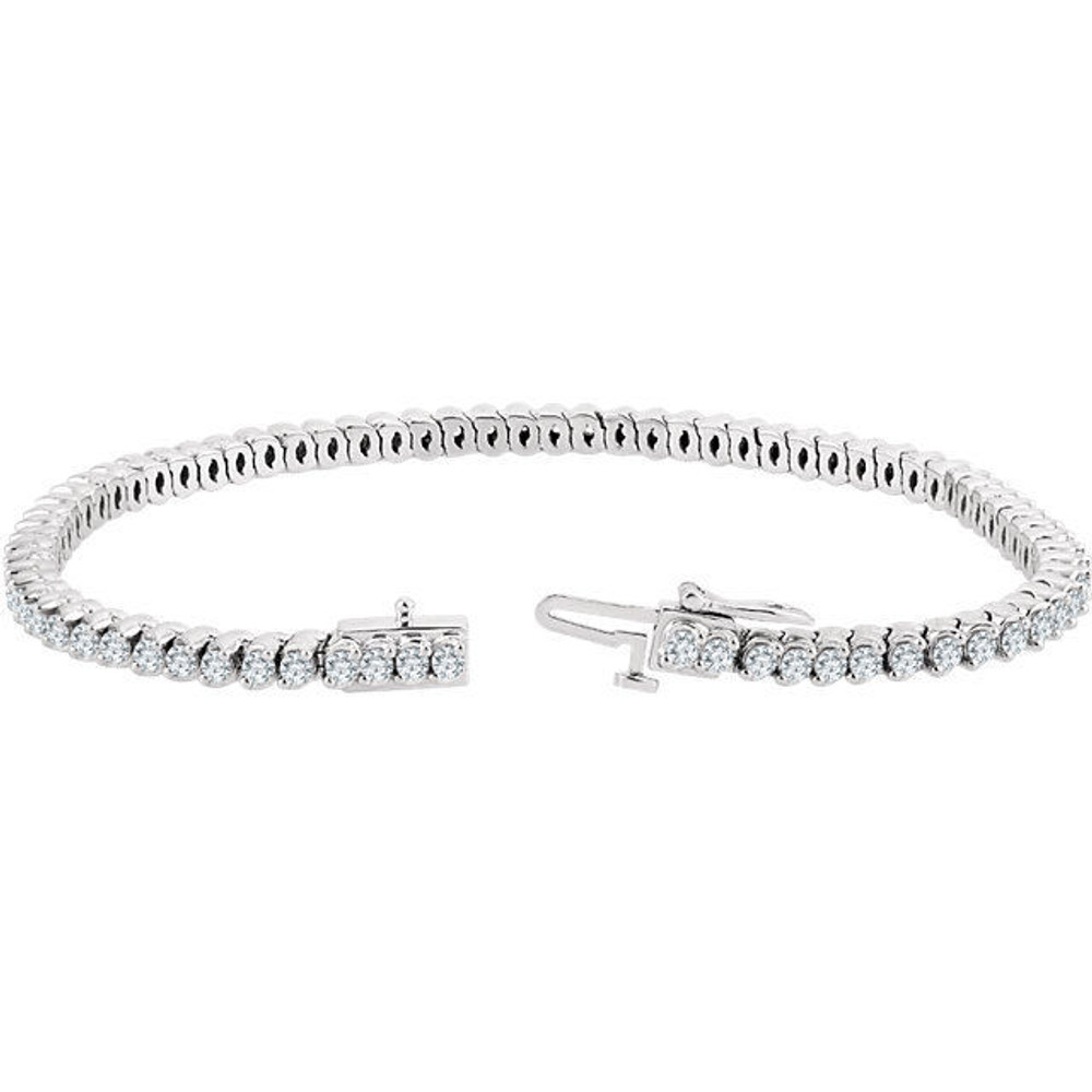 Flash some brilliance with this breathtaking tennis bracelet, showcasing dazzling round diamonds in complementing 14k white gold. 