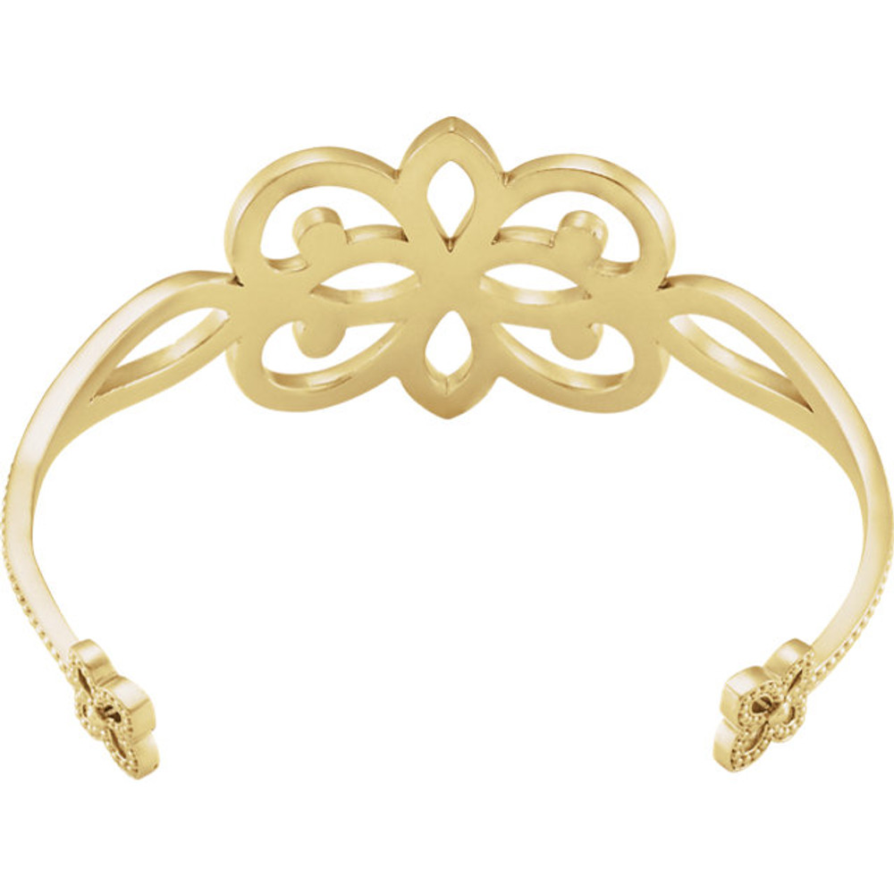 Fashioned in 14K yellow gold, this 6.5" Granulated Cuff Fashion bracelet weighs 22.72 grams and has a bright polish to shine.