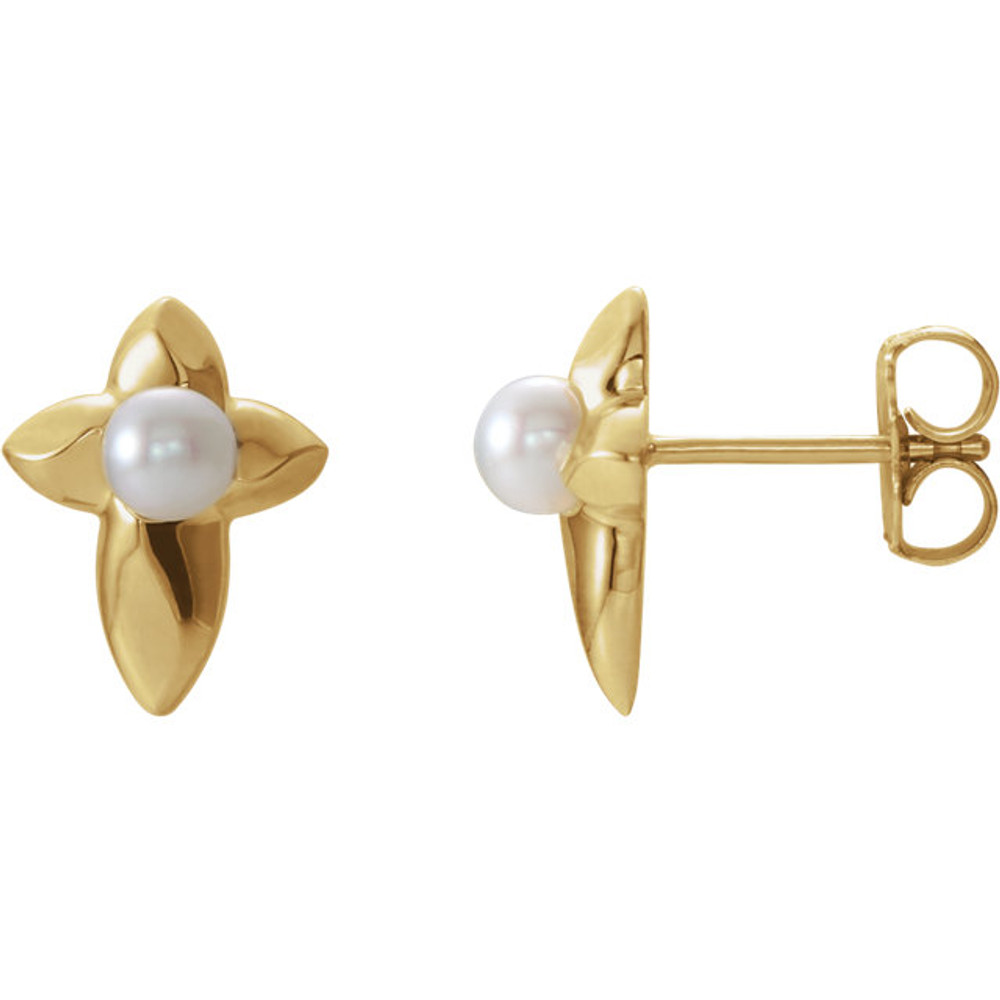 Stylish and symbolic. These freshwater cultured pearl cross earrings are in 14k yellow gold. Each earring measures 11.80x09.00mm and has a bright polish to shine.