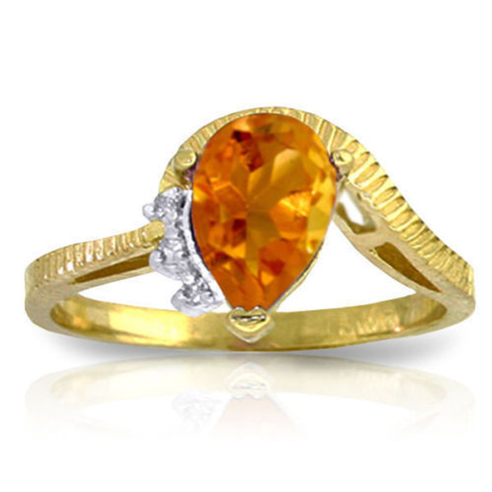 This 14k gold ring with natural diamonds and citrine makes a fabulous November birthstone ring, but is also great for anyone born anytime during the year as a great ring that is wearable everyday. The beautiful band is formed from 14k yellow, white, or rose gold and features a beautiful carved design that makes it stand out and draws attention to the amazing citrine that is the center stone. The 1.50 carat pear cut stone is accented with three small round diamonds that add just a touch of glitter and draw the eyes to the amazing glow of the beautiful citrine.