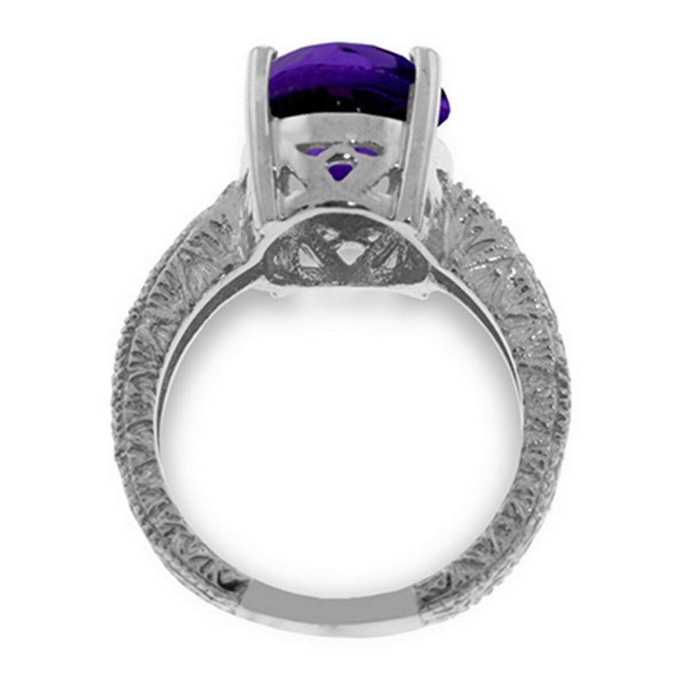 A 14 karat Gold Ring features a glistening Oval shape Natural Amethyst.