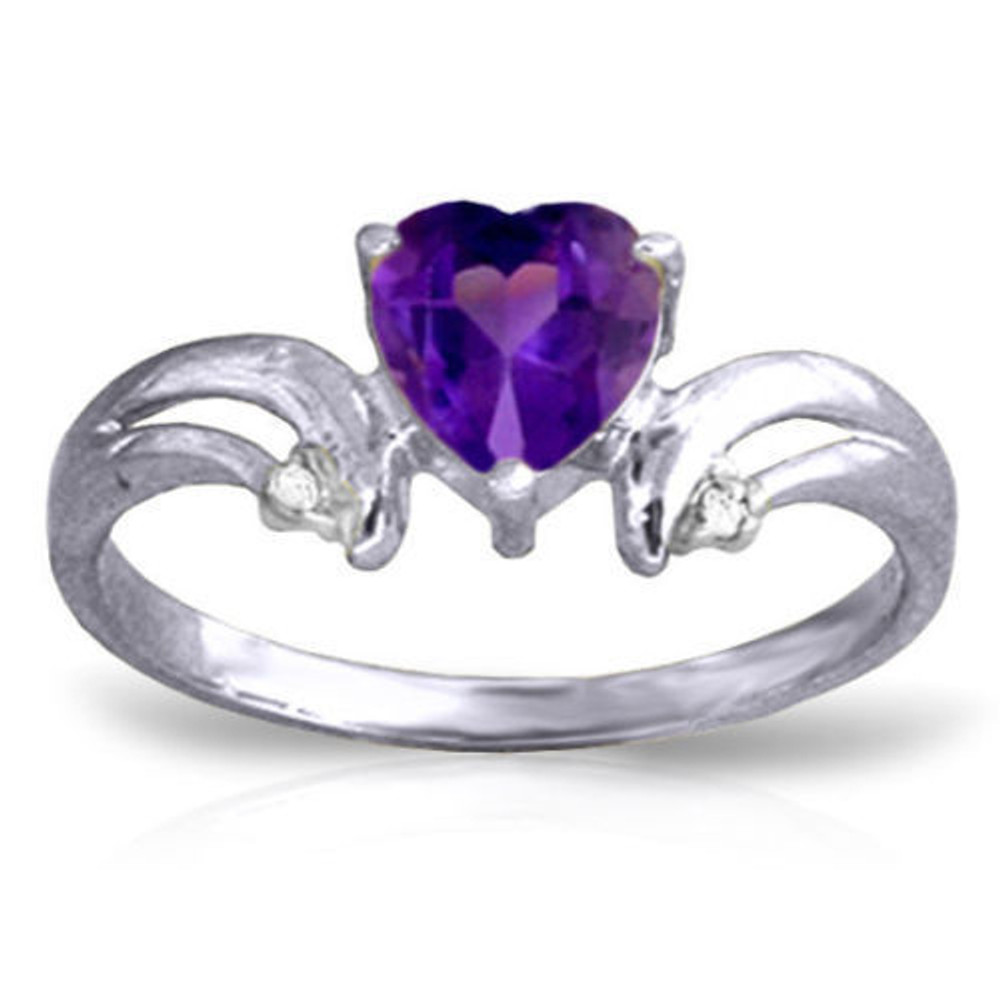 Purple is the color of royalty, and the curves of the band on the 14K. Solid Gold Ring with Natural Diamonds & Purple Amethyst make the heart-shaped amethyst stand out like its crowning achievement. Natural diamonds accent the tips of the curves at each side of the amethyst. A wearer is sure to feel like royalty when the 14K. Solid Gold Ring with Natural Diamonds & Purple Amethyst decorates her finger.
