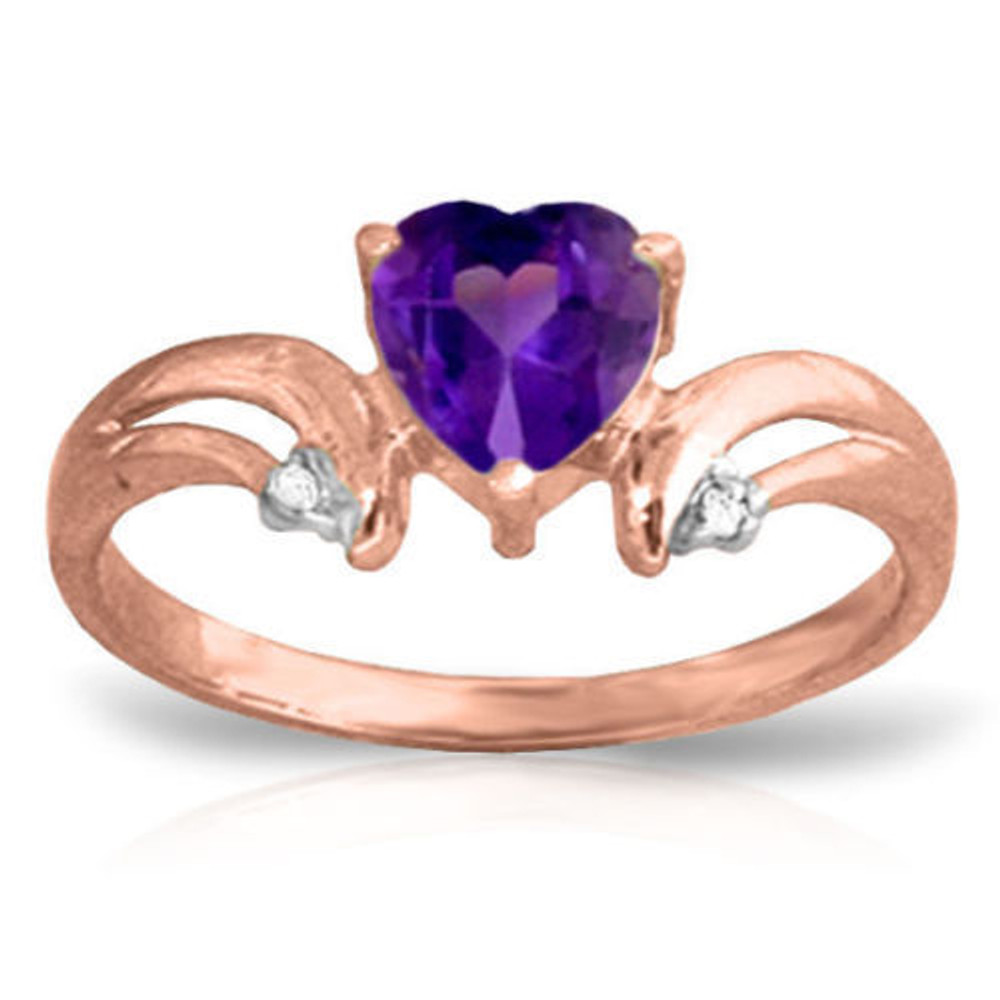 Purple is the color of royalty, and the curves of the band on the 14K. Solid Gold Ring with Natural Diamonds & Purple Amethyst make the heart-shaped amethyst stand out like its crowning achievement. Natural diamonds accent the tips of the curves at each side of the amethyst. A wearer is sure to feel like royalty when the 14K. Solid Gold Ring with Natural Diamonds & Purple Amethyst decorates her finger.