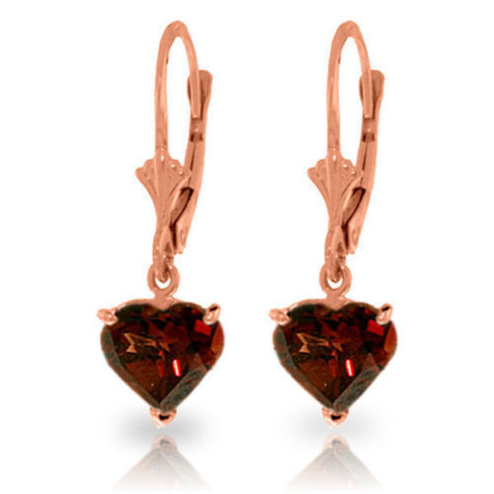 The brilliance of garnet shine with these cute 14k gold leverback earrings with natural garnets. The stunning red color of garnets are flawlessly shown off when dangling from sophisticated leverbacks, which make wearing these earrings comfortable and secure. Two heart shaped natural gems make up each pair, adding over three carats of gorgeous color to these lovely earrings. This pretty piece of jewelry makes a wonderful birthstone gift for loved ones who blow out their candles in January. They also make a wonderful token to give to that special someone to remind them that they are loved.