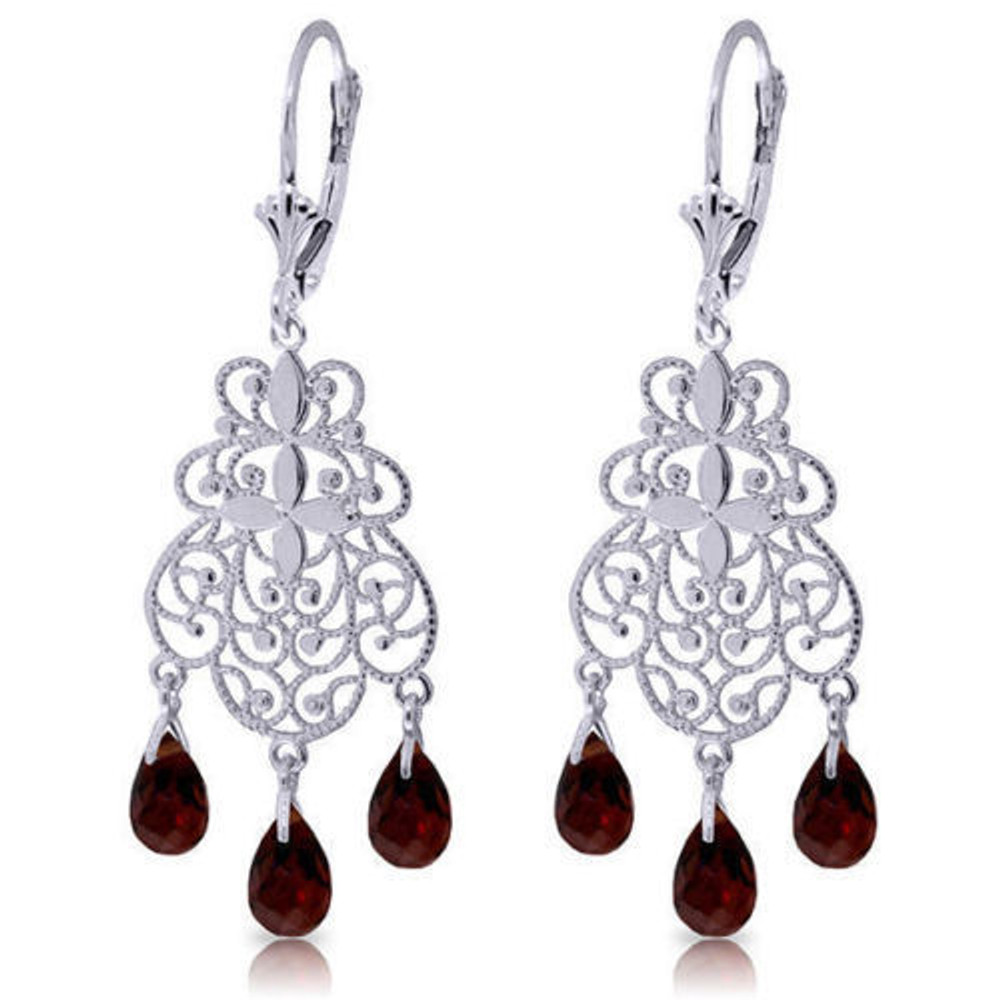 Wow everyone when you wear these wonderful gold filigree chandeliers! Solid 14K gold filigrees dangle from comfortable, secure leverback earrings. Three natural garnet briolettes, totaling nearly 1.5 carats, dangle from the bottom of each. The deep red of the garnet, the fantasy style, and the large size (1.76 inches long!) will look fabulous with ethnic-influenced fashion or will add your own ethnic touch to more conventional styles. Choose rose gold, yellow gold, or white gold to best complement your wardrobe and your own coloring. If you're a gypsy woman or if you can just imagine being one, these earrings are for you!