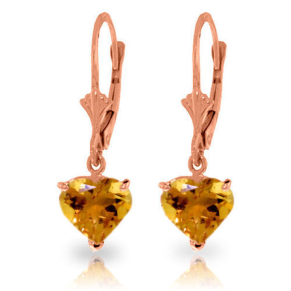 These earrings are perfectly pretty and will make you feel like a total princess. Made with 14 karat yellow, white or rose gold, they are accented by natural citrine stones shaped like hearts. These sweetheart earrings make the perfect gift for a young lady you love. They express youthfulness and innocence, and are a truly special piece. The gold lever-back earrings are just one inch in total height, and they dangle just a tiny bit below the lobe. They can be worn everywhere for any occasion, making them the ideal piece to add to your collection.