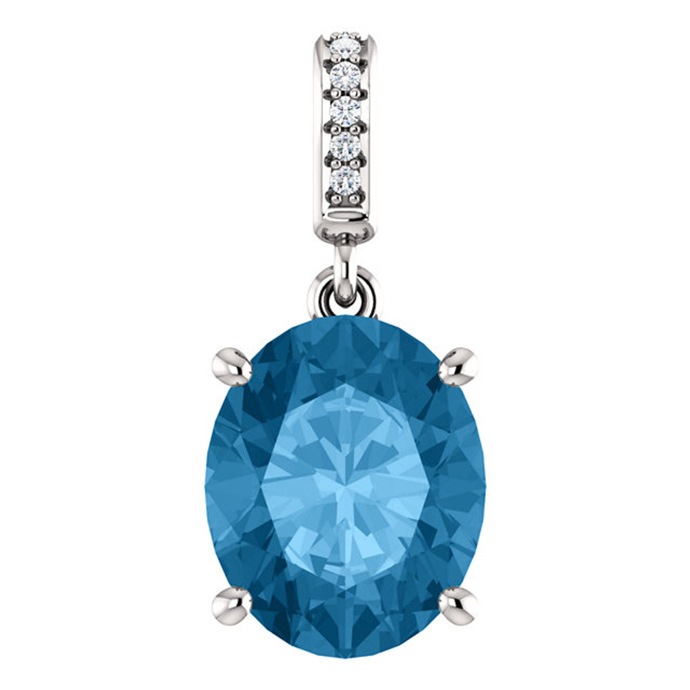 This is a beautiful pendant necklace in 14K White Gold featuring a Natural; Blue Topaz Gemstone & genuine Diamonds. The pendant consist of 1 Oval Shape, 11x9 mm, Blue Topaz Gemstone with 6 Accent genuine Diamonds. It is presented on an 18" 14K White Gold Diamond Cut Cable Chain. This necklace is both Elegant and Classic - Perfect for everyday. The inherent beauty of these gems make this an ideal way for you to show your love to someone you care for.