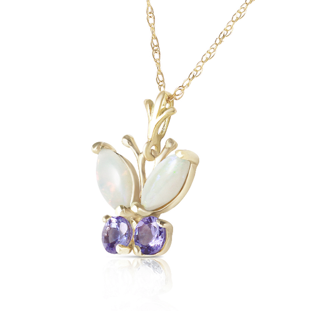  Make that special someone's heart soar when she sets eyes upon this amazing 14k yellow gold butterfly necklace with opals and tanzanites. This necklace is cute and understated, but still makes a statement with the bold use of gorgeous natural gemstones. Two delicate wings are made from marquise cut opals, while the rest of the butterfly is made of two round cut tanzanite stones, both gems offering plenty of sparkle to make this piece really outshine the rest. The illusion of a fluttering butterfly is completed when dangled from an 18 inch white gold rope chain.