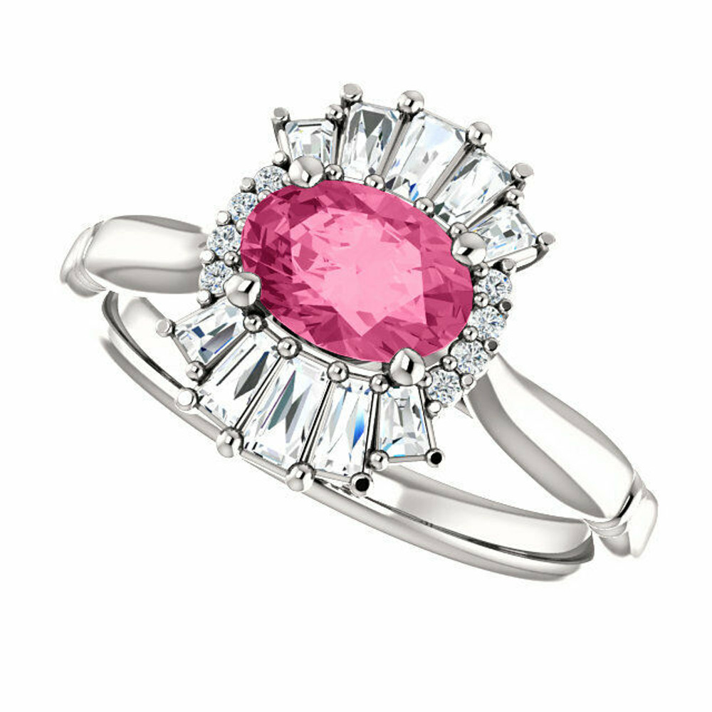 Crafted in platinum, this ring features one oval Genuine Pink Tourmaline gemstone accented with 18 genuine diamonds. 