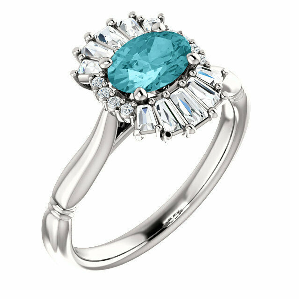 Crafted in platinum, this ring features one oval Genuine Blue Zircon gemstone accented with 18 genuine diamonds. 