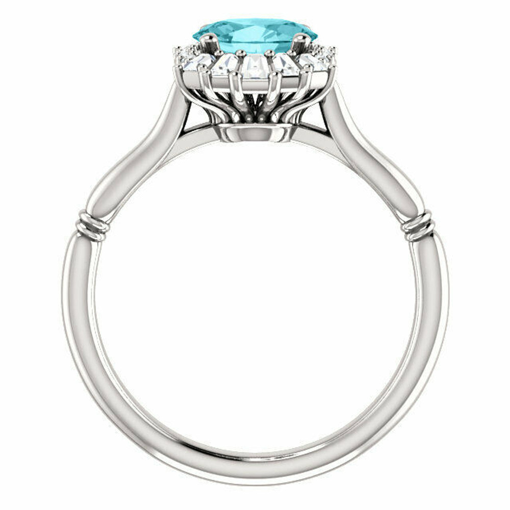 Crafted in platinum, this ring features one oval Genuine Blue Zircon gemstone accented with 18 genuine diamonds.