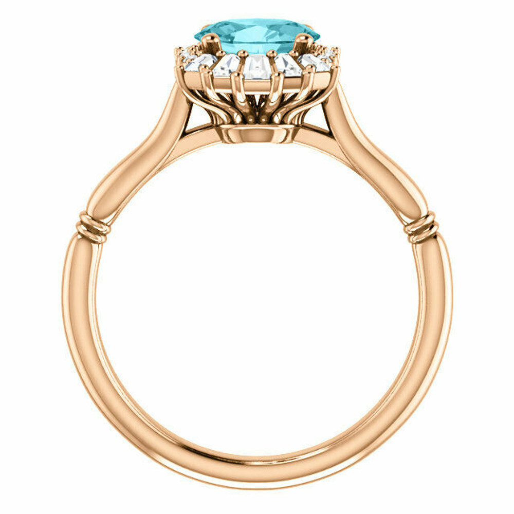 Crafted in 14k rose gold, this ring features one oval Genuine Blue Zircon gemstone accented with 18 genuine diamonds. 