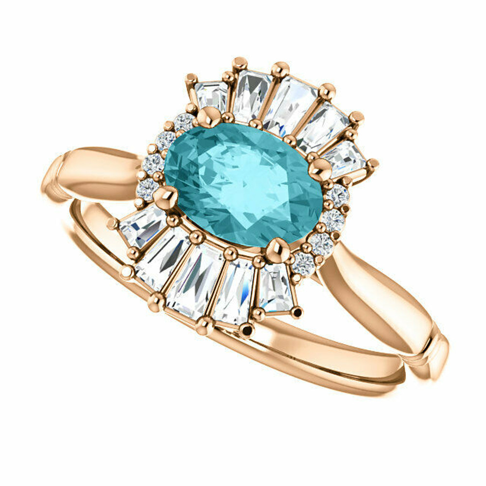 Crafted in 14k rose gold, this ring features one oval Genuine Blue Zircon gemstone accented with 18 genuine diamonds. 