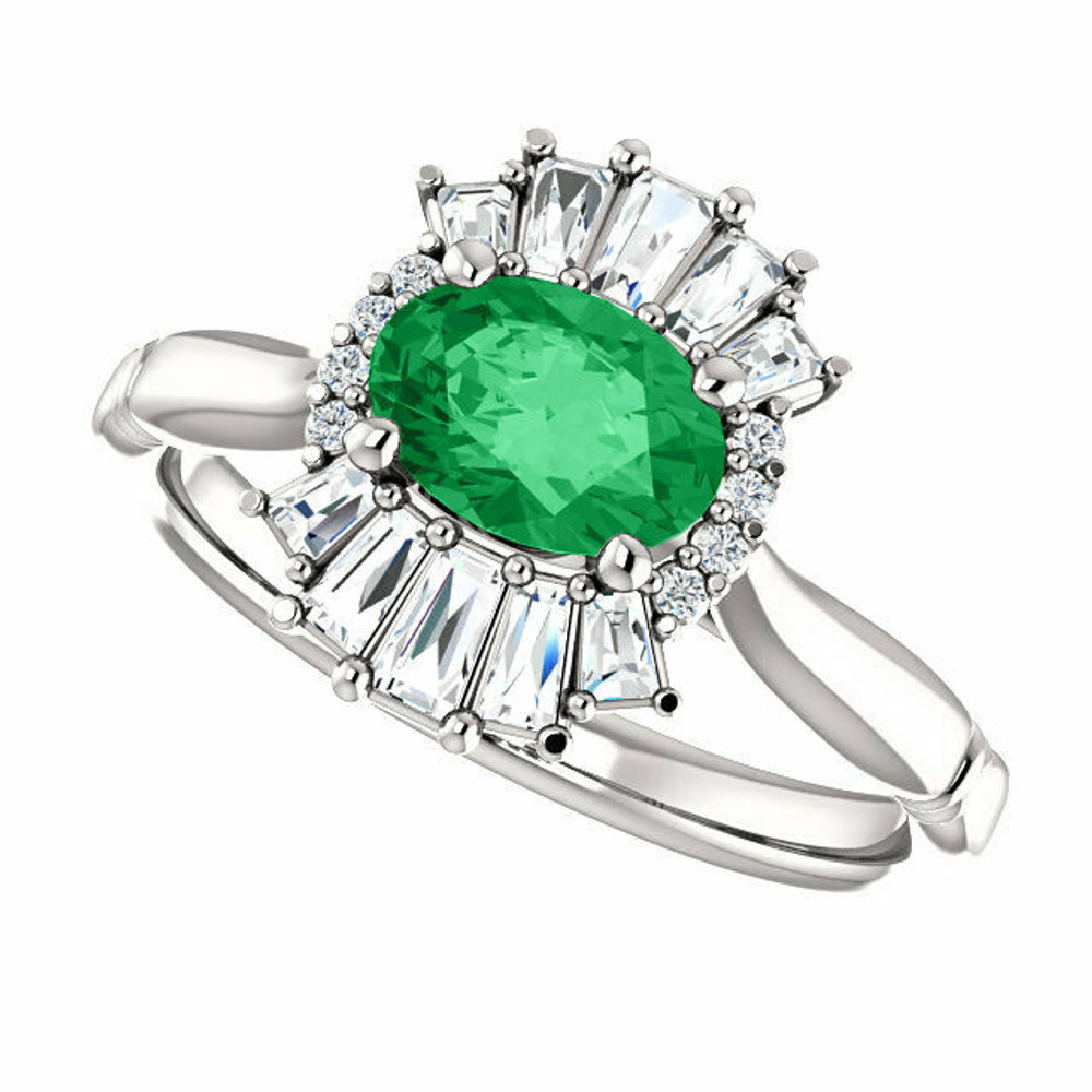 Crafted in platinum, this ring features one oval Genuine Emerald gemstone accented with 18 genuine diamonds. 