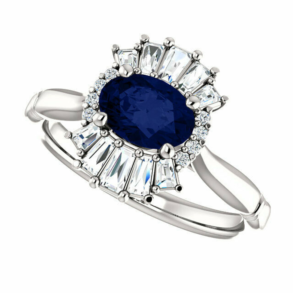 Crafted in 14k white gold, this ring features one oval Chatham Created Blue Sapphire gemstone accented with 18 genuine diamonds. 