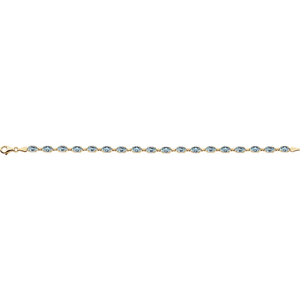 Celebrate her December birthday with this stunning bracelet. Fashioned in 14K Yellow Gold, this eye-catching bracelet is lined with glistening blue topaz stone - a colorful take on tradition. Polished to a brilliant shine, this is a 7.25 inch bracelet. 