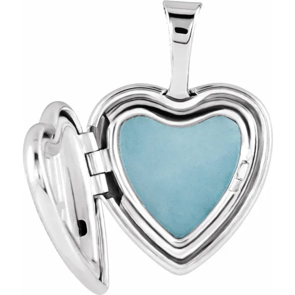 Beautiful heart locket with cross made in sterling silver. Polished to a brilliant shine.