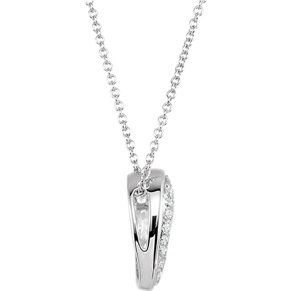 This petite heart pendant crafted from 14k gold is prong set with 55 round diamonds totaling 1/4 ct. tw. and will set hearts aflutter with its sparkling open design. The polished slide is approximately 13mm long by 14mm wide and comes with a matching 18-inch cable chain. The various sized diamonds are I1 in clarity and H-I in color.