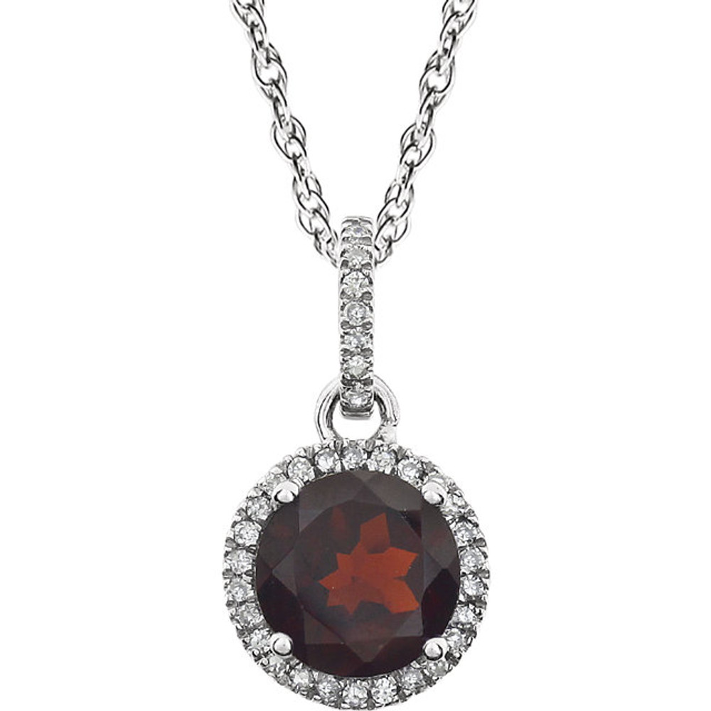 Garnet and Diamond 14k White Gold Halo-Styled 18" inch Birthstone Pendant Necklace. A 7.0mm Genuine Round Garnet is surrounded by 1/10 ct.tw. of Sparkling Genuine Round Diamonds.