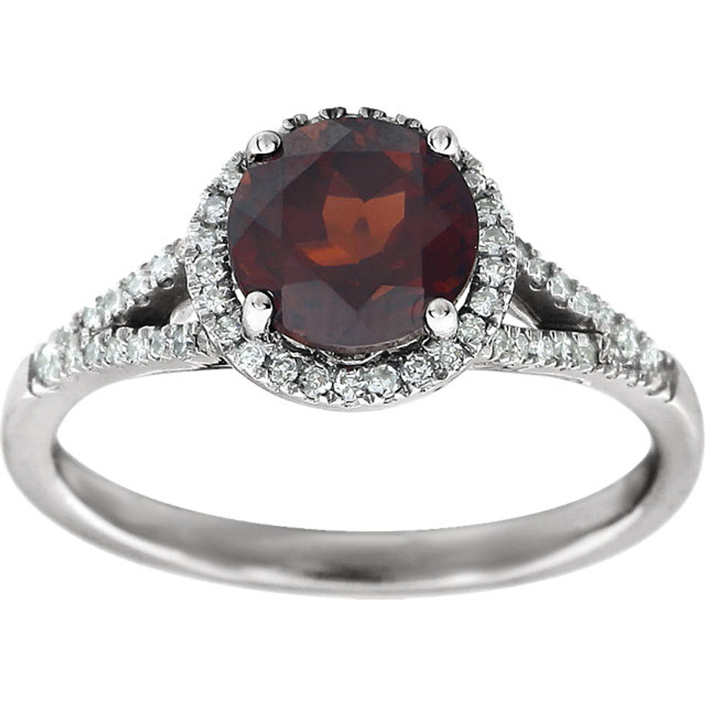 Beautiful Halo-style Gemstone Ring in 14K White Gold featuring a Natural Garnet Gemstone & Diamonds. The ring consist of 1 Round Shape, 7.0 mm, Garnet Gemstone with 56 Accent genuine Diamonds. This ring is both Elegant and Classic - Perfect for everyday. The inherent beauty of these gems make this an ideal way for you to show your love to someone you care for.