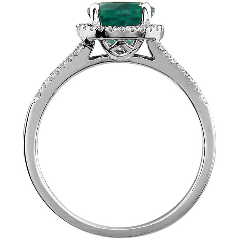 Beautiful Halo-style Gemstone Ring in 14K White Gold featuring a created emerald ring Gemstone & Diamonds. The ring consist of 1 Round Shape, 7.0 mm, Created Emerald Gemstone with 56 Accent genuine Diamonds. This ring is both Elegant and Classic - Perfect for everyday. The inherent beauty of these gems make this an ideal way for you to show your love to someone you care for.