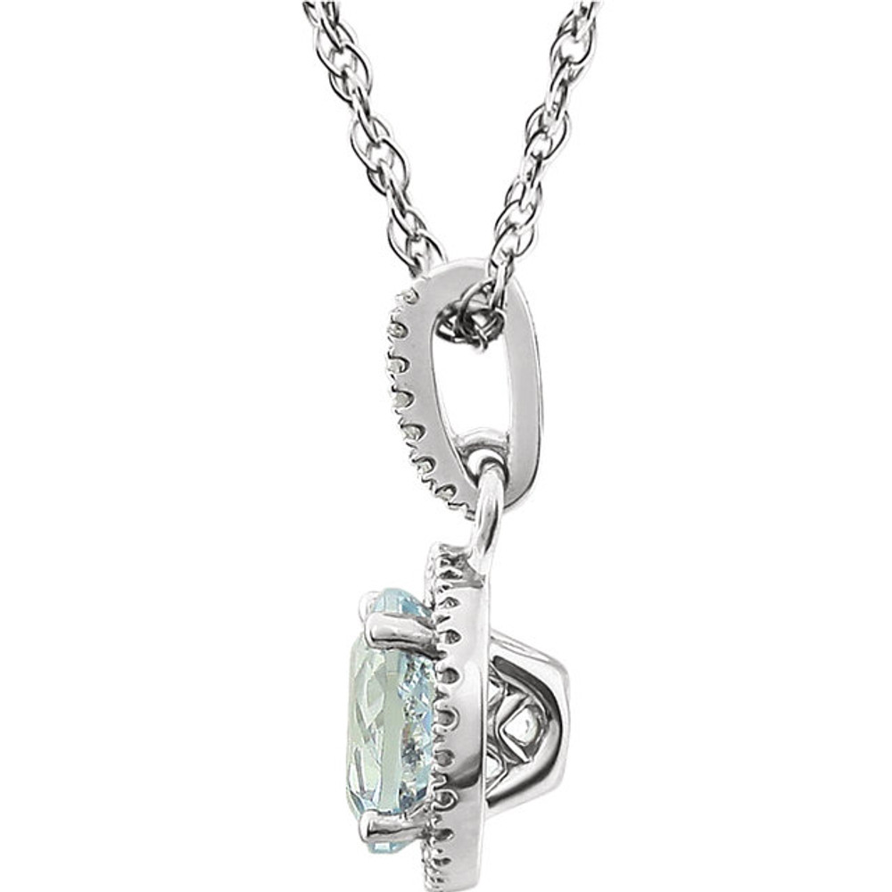 Aquamarine and Diamond 14k White Gold Halo-Styled 18" inch Birthstone Pendant Necklace. A 7.0mm Genuine Round Aquamarine is surrounded by 1/10 ct.tw. of Sparkling Genuine Round Diamonds.