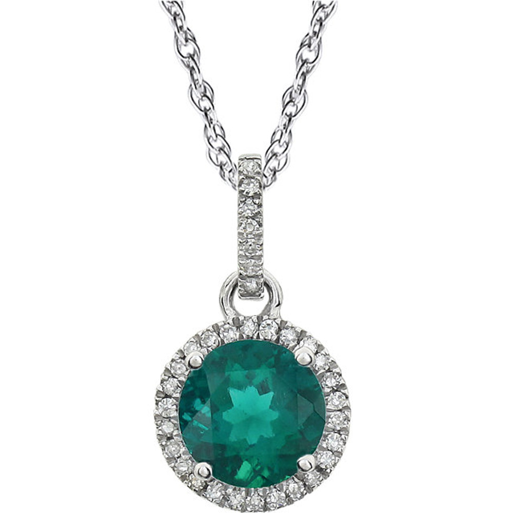 Emerald and Diamond 14k White Gold Halo-Styled 18" inch Birthstone Pendant Necklace. A 7.0mm Genuine Round Emerald is surrounded by 1/10 ct.tw. of Sparkling Genuine Round Diamonds.