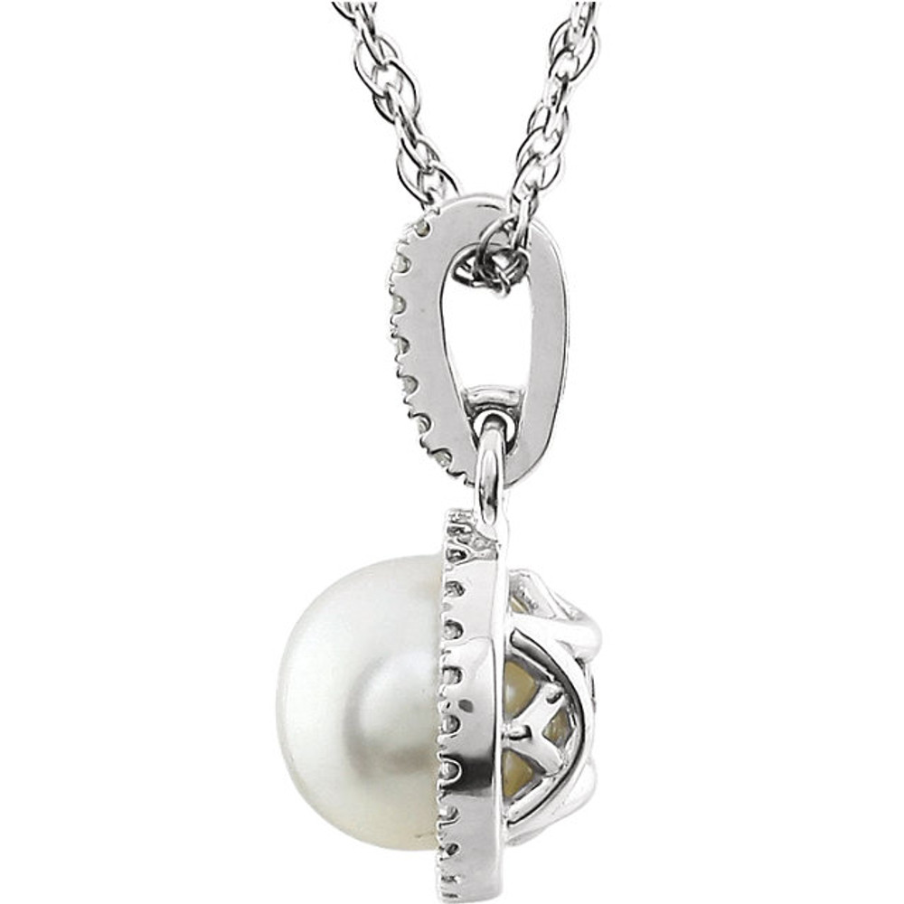 Pearl and Diamond 14k White Gold Halo-Styled 18" inch Birthstone Pendant Necklace. A 7.0mm Genuine Round Emerald is surrounded by 1/10 ct.tw. of Sparkling Genuine Round Diamonds.