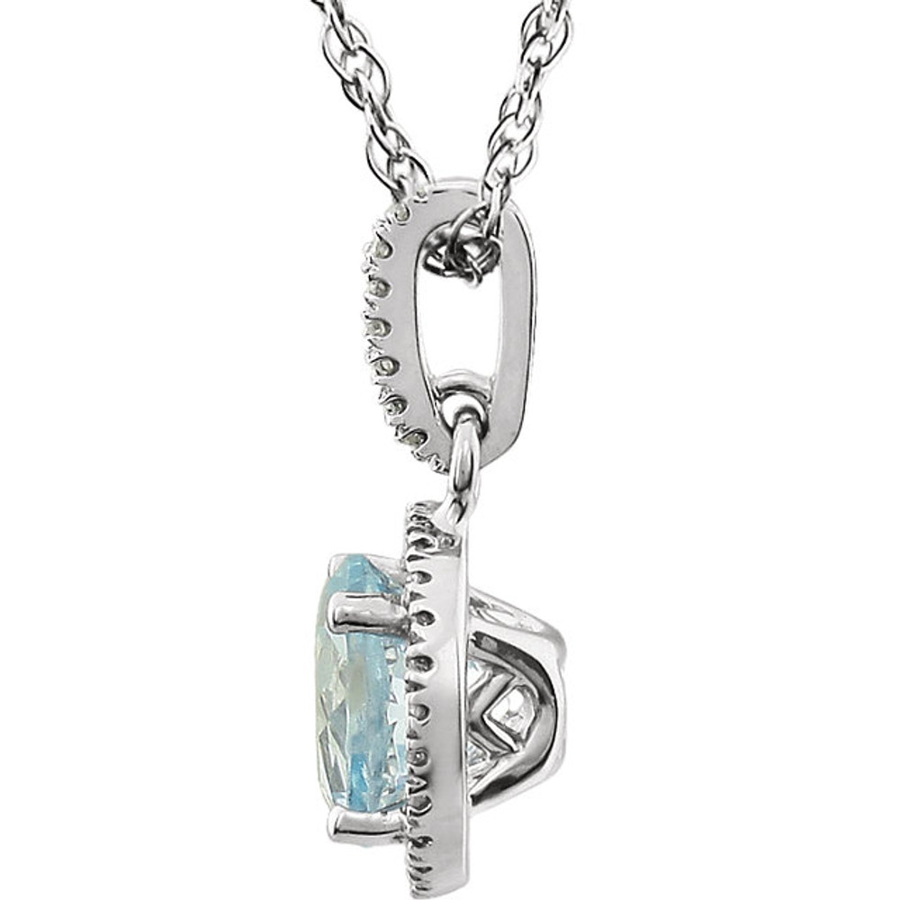 Sky Blue Topaz and Diamond 14k White Gold Halo-Styled 18" inch Birthstone Pendant Necklace. A 7.0mm Genuine Round Blue Toapz is surrounded by 1/10 ct.tw. of Sparkling Genuine Round Diamonds.