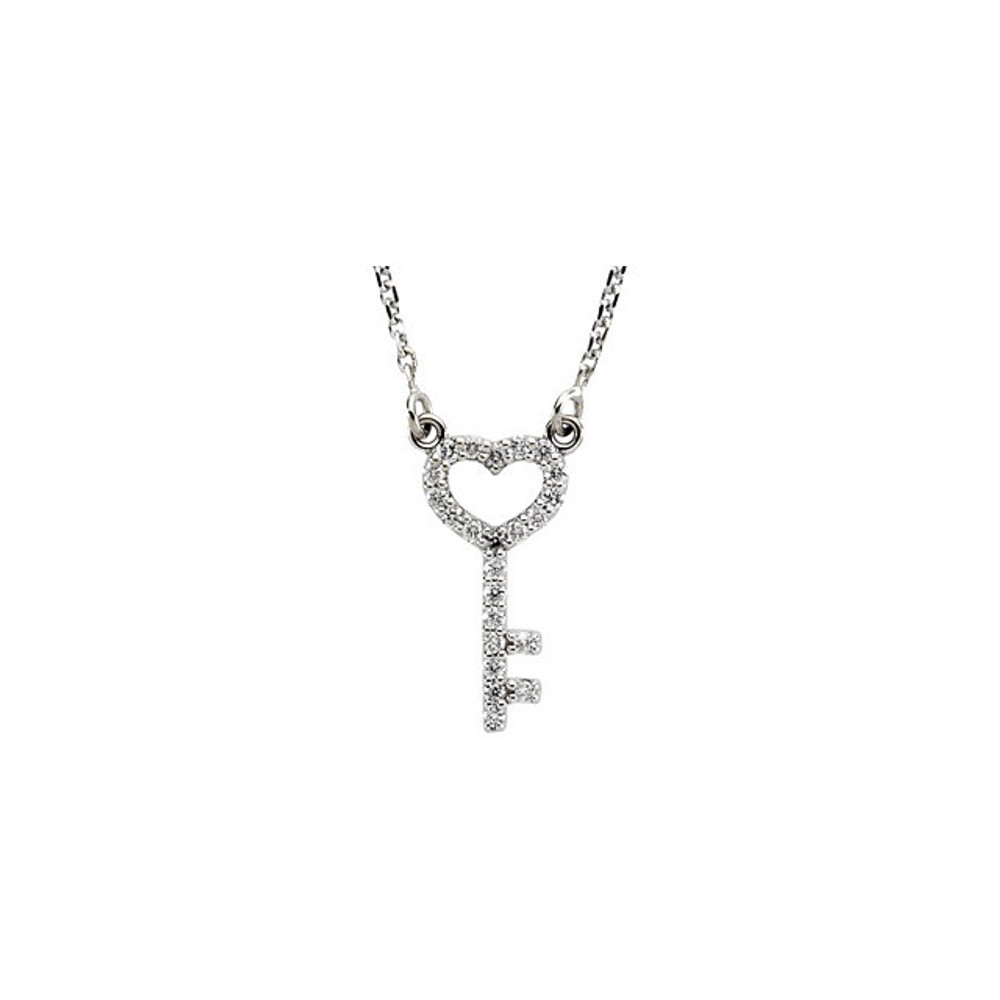 This petite heart & key crafted from 14k white gold is prong set with 23 full cut round diamonds and represents safety, trust, love and security. Attached to the open-heart bow is a 1mm diamond-cut cable chain that is 16-inches long and finished with a spring ring clasp. Pendant measures approximately 14mm long by 7mm wide. 1/8 of a carat total diamond weight.