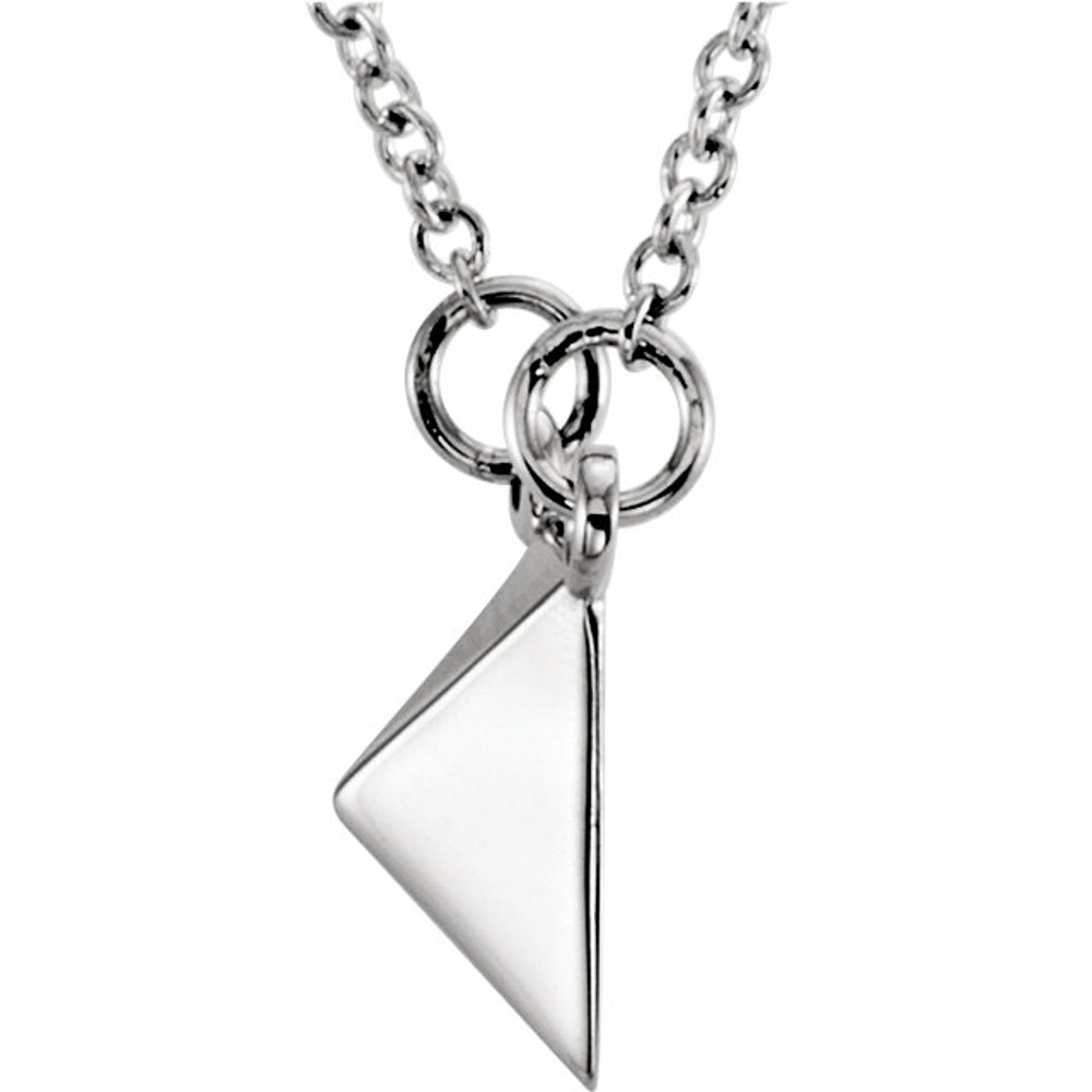 Fashioned in 14K white gold, the pendant alone is solid and weighs 3.25 grams. It comes with a 14K white gold sold cable 16.00 inch chain.