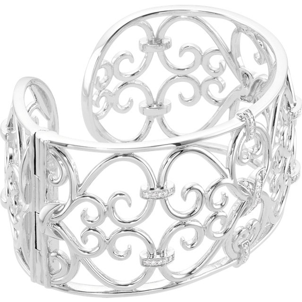 Elegant, geometric and intricate, illuminate your wrist in this sterling silver bracelet. A bangle of beauty, outlined in diamonds form a decorative pattern. Perfect for parties or an afternoon with friends, this 7.0-inch cuff is rich with diamonds totaling 1/3 ct.