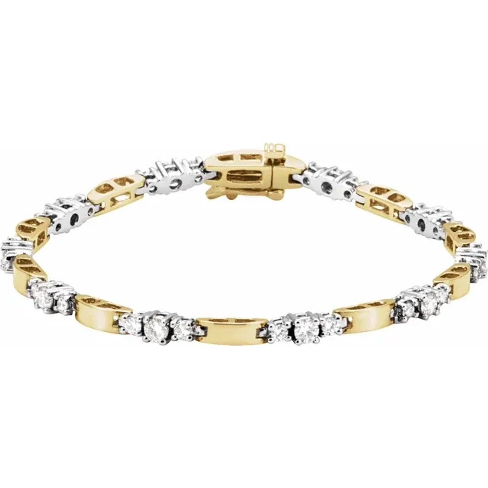 30 round, brilliant cut diamonds are set in 14k white/yellow gold, four-prong tennis bracelet.
