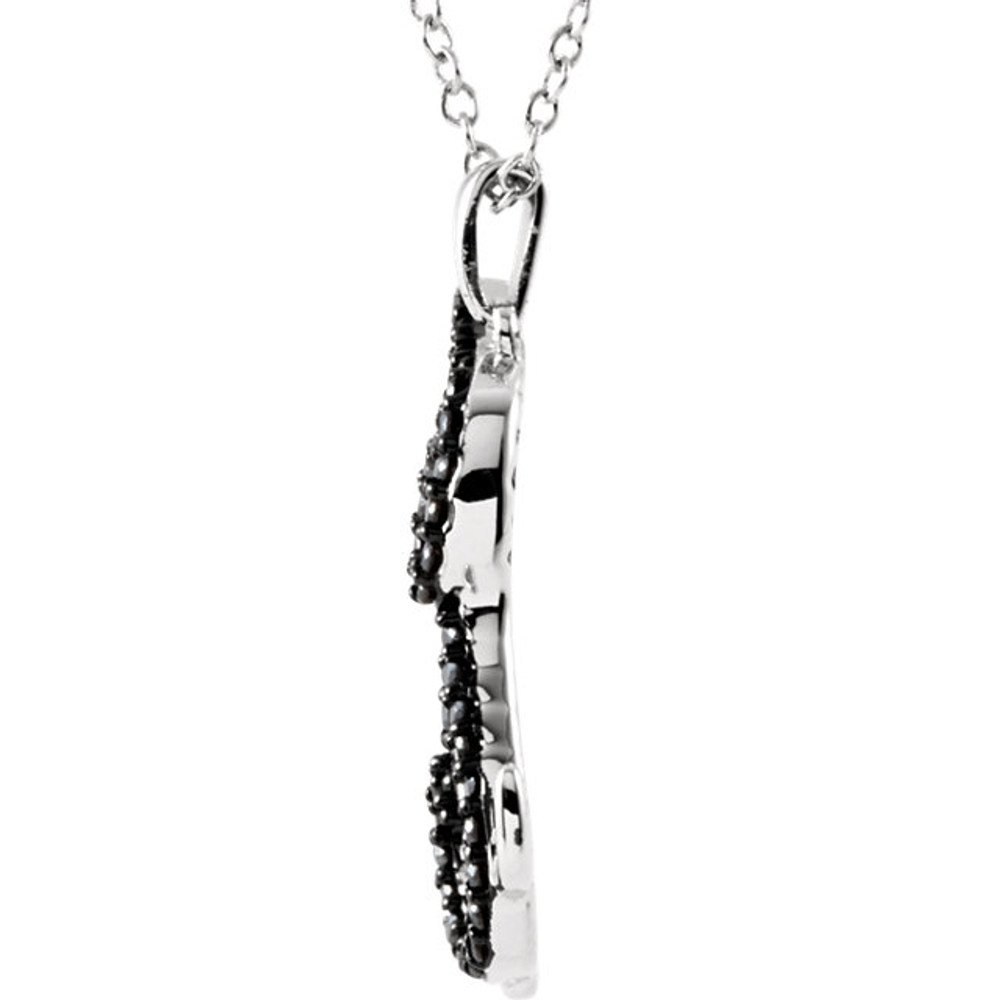 A precious, perching dog makes a charming statement on this sterling silver pendant featuring shimmering black and white diamonds.