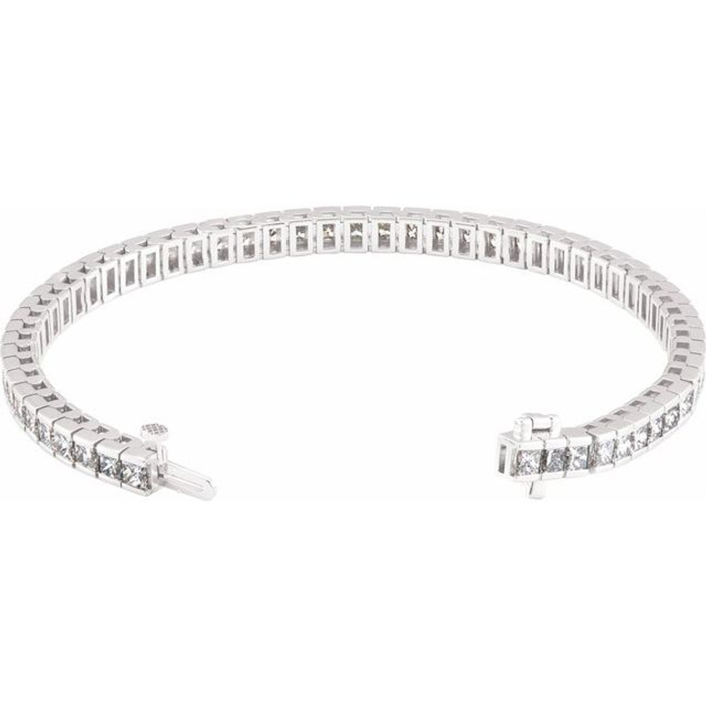 This fabulous 9 1/3 ct. t.w. diamond tennis bracelet is a breathtaking piece that we really love. Sparkling and sensational, it's a classic that features a stream of princess cut diamonds so gorgeous that it will have heads turning for a second look. 18kt white gold bracelet.