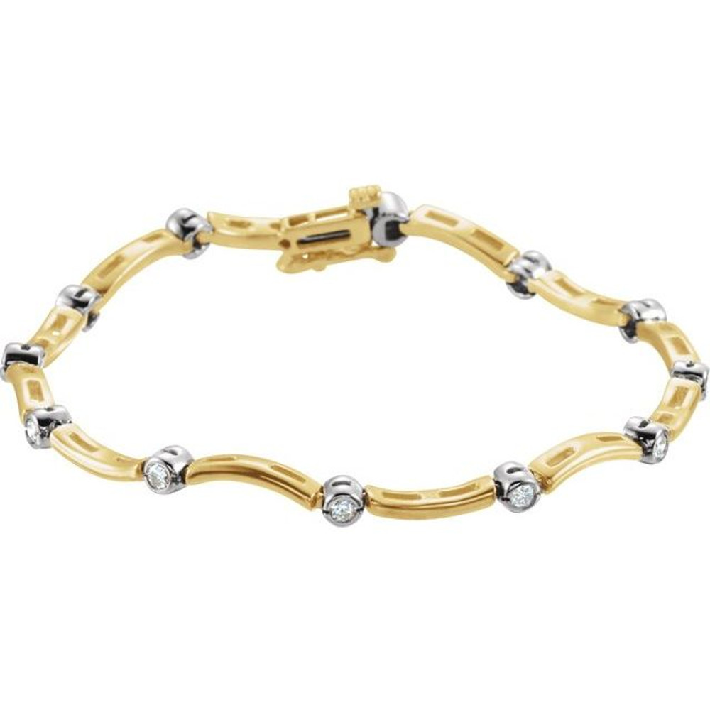 This gorgeous bracelet, hand set with 12 brilliant diamonds and 14k yellow gold, is sure to turn heads with its delicate design and classic appeal.