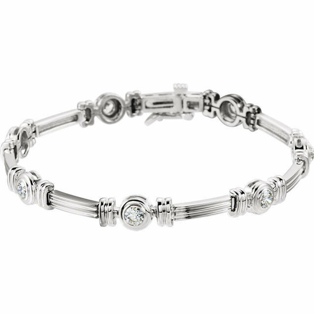 Simple and brilliant, this bezel-set 7.25" bracelet features 7 round, brilliant diamonds set in 14k white gold.