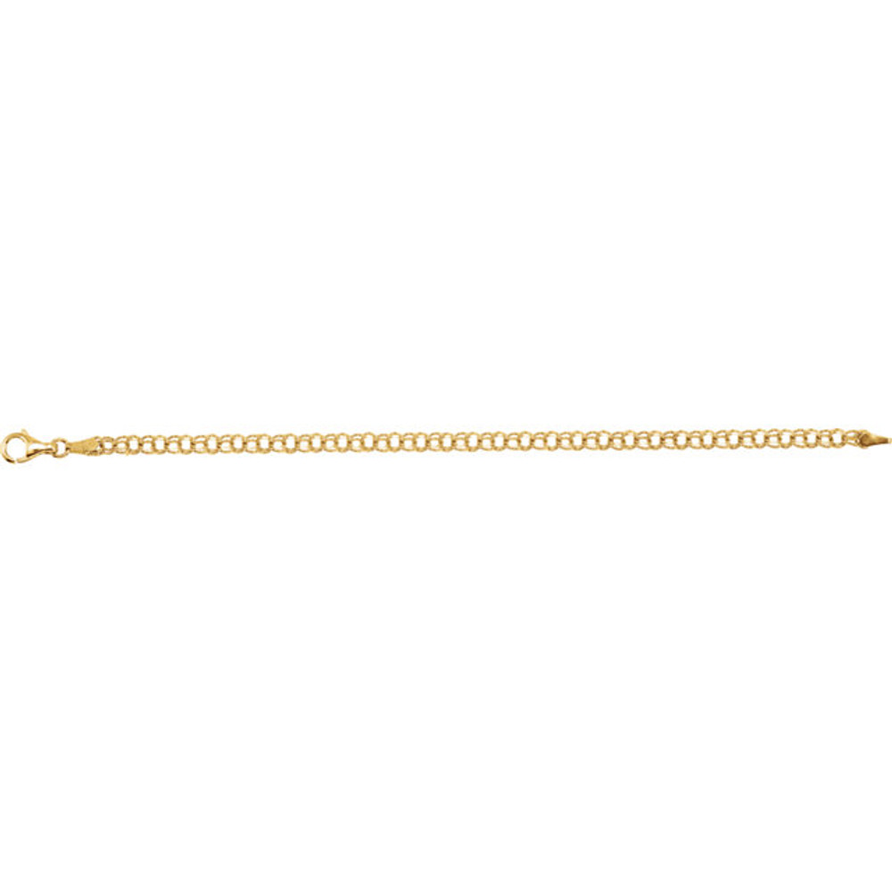 Classic, solid 14K yellow gold charm bracelet is seven inches in length and is approximately 1/8th inch wide.  The bracelet is made in the double curb style.  It is connected with a sturdy lobster claw clasp.
