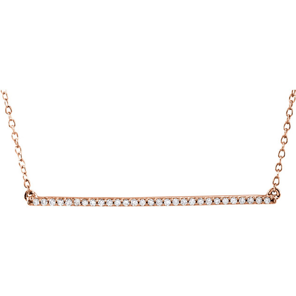 A straight bar is the focal point in this petite necklace for her. Suspended between cable chains, the 14K gold 18 inch necklace in length and fastens with a lobster clasp.
